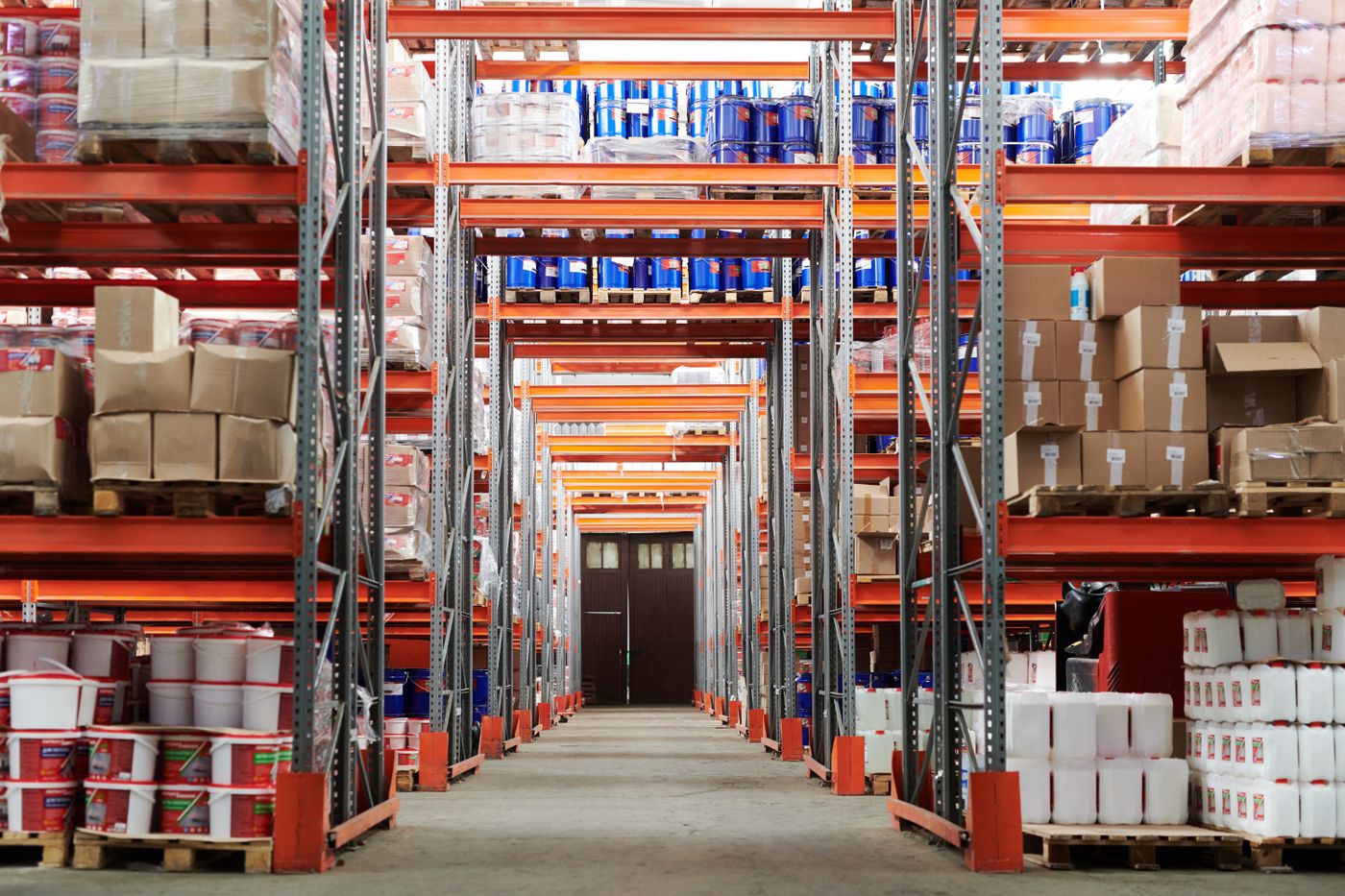 Organised logistics warehouse aisle representing professional parcel intake and delivery operations